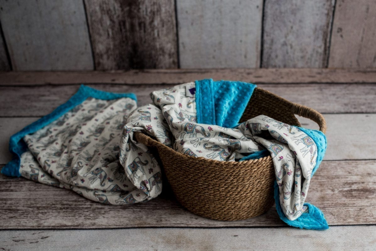 Teal/Elephant luxury weighted blanket in basket